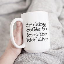 Load image into Gallery viewer, Drinking Coffee to Keep the Kids Alive